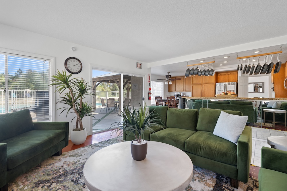 A shared lounge with green sofas at the Got Recovery residence